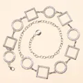 Close-up of silver geometric waist chain with textured round and square metal links - Silver