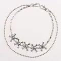 Detail of silver dual-layer hip hop chain with crystal-studded skull charms and lobster clasp - Silver Double Layer Skull Chain