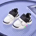 Sneakers LED per bambini bianche e nere con suola luminosa e cinturino in velcro - 21 (13.5) / Nero