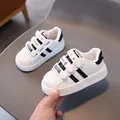 Kids white faux leather sneakers with black stripes and hook and loop closure straps - EU 21 / White