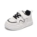 Beige kids sports shoes with black accents, faux leather upper and poker-patterned sole - EU 22 / Black