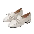 Women's beige square-toe loafers with a bow and gold metal tips on a chunky low heel - EU 34 / Apricot
