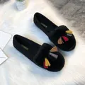 Winter faux fur loafers for women with colorful fringe tassels on a soft white carpet - EU 34 / Black