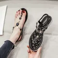 Women's flat toe ring sandals in black with sparkling blue gemstone and rhinestone trim - EU 34 / Black