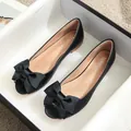 Women's black leather peep-toe flat shoes with an elegant oversized bow decoration - EU 34 / Black
