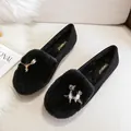 Women's warm black faux fur loafers featuring a decorative metal owl buckle design - EU 34 / Black