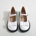 Glossy white Mary Jane shoes with bow detail and chunky black anti-slip sole - EU 35 / White