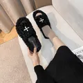 Chic black plush slippers with white criss-cross buckles and thick platform sole - EU 34 / Black