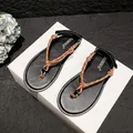 Women's black thong sandals featuring brown braided rope knot and flat casual sole - 34 / Brown Knot