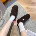 Dark brown fleece clogs with adjustable buckle and platform sole on white socks - EU 35 / Dark Brown