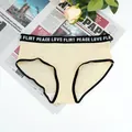Detail of light beige ribbed panties featuring a black elastic waistband with white lettering - S / Yellow