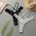Lace thong underwear in black and white featuring delicate hollow-out floral lace and crisscross straps - S / Black and White