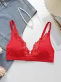 Detail of red seamless lace bra with deep V-neckline and elegant wireless design - S / Red