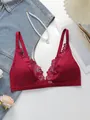 Detail of deep red lace trim and deep V-neckline on a seamless wire-free bra - S / Burgundy