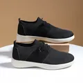 Breathable black knit mesh casual sneakers with thick white soles on display stand - EU 35 / Black and White