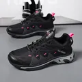 Men's breathable mesh sneakers in black and gray with vibrant pink accents for running - 39 / Black