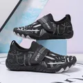 Kids black water shoes with white stripe pattern and adjustable sport strap - 26 / Black