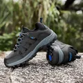 Bottes de randonnée gris foncé avec détails bleus et semelles en caoutchouc antidérapantes - 36 / Noir et Gris