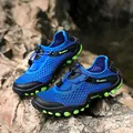 Blue breathable mesh outdoor wading shoe with toggle laces on a rocky terrain - EU 39 / Blue