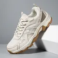 Outdoor hiking shoes in cream mesh and leather with thick brown lug soles for traction - Off White