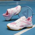 Pink and white badminton shoes with breathable mesh and sport logo on blue court - 36 / White Pink