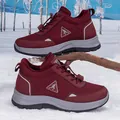 Winter wine red non-slip thermal hiking boots for elderly women on snowy forest background - 35 / Wine Red