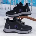 Winter sport shoe for women in grey and black with purple accents on snowy ground - Black Purple