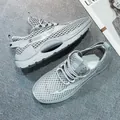Light grey breathable mesh running shoes with thick cushioned sole and lace-up closure - EU 39 / Gray