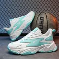 Fashionable white and mint green chunky sports sneaker for women with breathable mesh panels - EU 39 / Ice Blue White