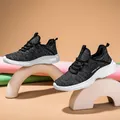 Women's lightweight breathable knit running shoe in black and white mesh with thick sole - EU 36 / Black