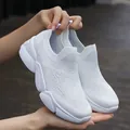 Lightweight white slip-on sneakers with breathable knit fabric and thick EVA sole - White