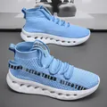 Light blue high-top breathable fly knit sneakers with a white hollow cushioning sole - EU 40 / Blue