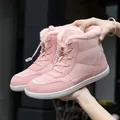 Pale pink high-top snow boots with plush faux fur lining and lace-up closure - EU 36 / Pink