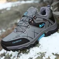Deep grey winter hiking boots with blue accents and warm faux fur lining in snow - EU 39 / Gray
