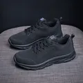 All-black breathable mesh running shoe with lace-up design and cushioning sole - Black