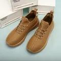 Fashionable camel brown leather sneakers with woven texture soles and cross stitching details - EU 40 / Brown