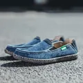 Blue denim slip-on loafer for men featuring elastic sides and a grey textured rubber sole - EU 39 / Blue
