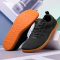 Minimalist black knit sneakers with vibrant orange non-slip rubber outsoles - EU 36 / Black
