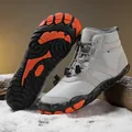Grey high-top outdoor winter boots with orange soles and warm lining on snow - EU 36 / Gray