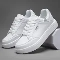 White low-top platform sneakers with fashion label and textured leather finish - 39 / Pure White