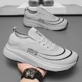 Men's light grey mesh running shoe with breathable fabric and cushioned white sole - EU 36 / Gray