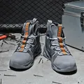 Grey high-top safety shoes with steel toe protection and orange safety text details - EU 36 / Gray