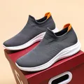 Dark grey slip-on knit sneakers with orange heel tab and white wavy foam sole - EU 36 / Gray