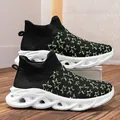 Men's black knitted sock sneakers featuring green star prints and cushioned white soles - EU 36 / Black and White