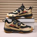 Breathable gold and black tennis shoes featuring dual rotary buckles and non-slip gum soles - 36 / Black & Gold
