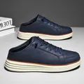 Men's navy blue leather slip-on loafers with thick white soles and open-back mule design - EU 39 / Dark Blue