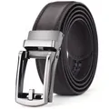 Detail of men's belt featuring a brushed metal automatic buckle and textured brown strap - Dark Brown