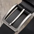 Classic men's black leather belt with brushed silver pin buckle on wooden background - Black / 105cm