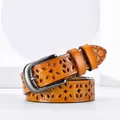Slim tan leather belt for women featuring decorative hollow floral patterns and silver buckle - 105cm / Camel