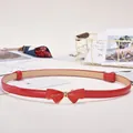 Bright red skinny faux leather belt for women featuring a golden bow buckle design - Gold Bowknot Buckle / Red